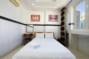 Postel nebo postele na pokoji v ubytování Lam Sơn Hotel 3 Tháng 2