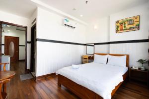 Postel nebo postele na pokoji v ubytování Lam Sơn Hotel 3 Tháng 2