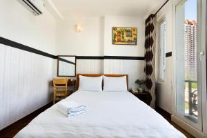 Postel nebo postele na pokoji v ubytování Lam Sơn Hotel 3 Tháng 2