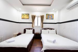 Postel nebo postele na pokoji v ubytování Lam Sơn Hotel 3 Tháng 2