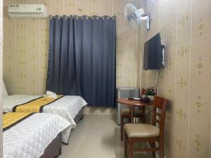 Katil atau katil-katil dalam bilik di Hotel Minh Phát