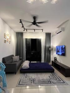a bedroom with a bed and a ceiling fan at FA Homestay KLIA in Nilai