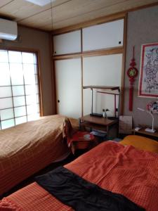 Postel nebo postele na pokoji v ubytování OSO Homestay