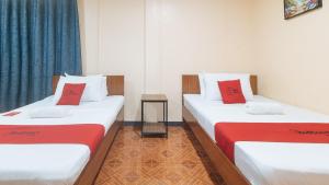 Postel nebo postele na pokoji v ubytování RedDoorz at Nirvana Pension House