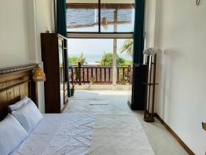 Postel nebo postele na pokoji v ubytování Ocean Air Guesthouse and Villa Weligama - MINUTE TO WAVES + 57 fotografií