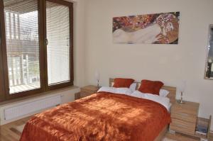Posteľ alebo postele v izbe v ubytovaní Olympic Park Apartment