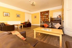 a living room with couches and a coffee table at YHA Langdale in Ambleside