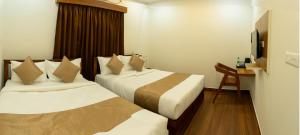 FLY VIEW Airport Residency客房内的一张或多张床位