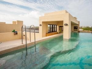 a swimming pool in the middle of a building at Oasis Hotel in Magong