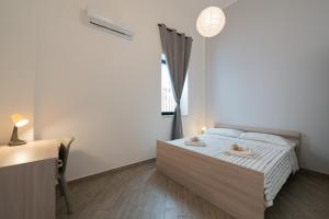 Cortile dei Giusti - Combo Guesthouse客房内的一张或多张床位