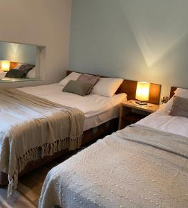 Posteľ alebo postele v izbe v ubytovaní Willa Jagiellonka apartamenty w centrum, parking