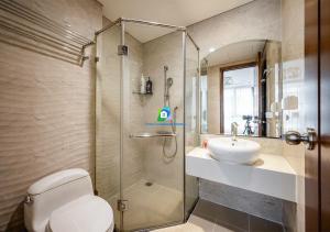 a bathroom with a shower and a toilet and a sink at the Vinhome Central apartment - The Best Landmark Area in Ho Chi Minh City +103 photos