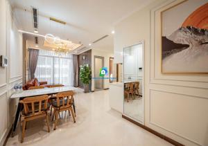 a kitchen and dining room with a table and chairs at the Vinhome Central apartment - The Best Landmark Area in Ho Chi Minh City