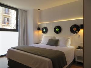 Кровать или кровати в номере Evenia Rocafort