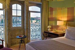 Säng eller sängar i ett rum på Pestana Vintage Porto Hotel & World Heritage Site