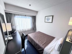 Postel nebo postele na pokoji v ubytování Grand Central Hotel