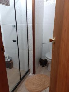 a bathroom with a shower and a toilet at Casa condomínio paz in Petrópolis