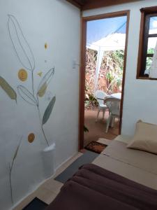 a bedroom with a bed in a room with a window at Casa condomínio paz in Petrópolis