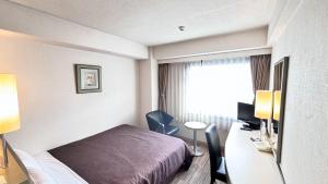 Postel nebo postele na pokoji v ubytování Grand Central Hotel