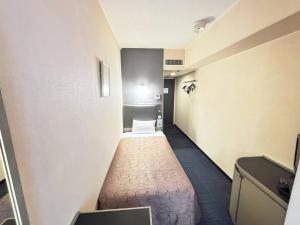 Postel nebo postele na pokoji v ubytování Grand Central Hotel