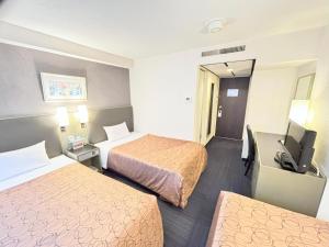 Postel nebo postele na pokoji v ubytování Grand Central Hotel