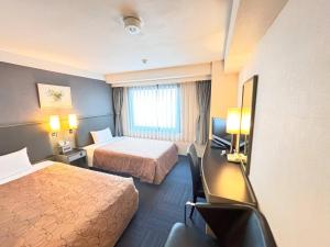Postel nebo postele na pokoji v ubytování Grand Central Hotel