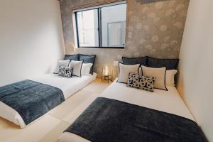 Una cama o camas en una habitación de JS暁宅-静寂 清澄 seijaku seichou