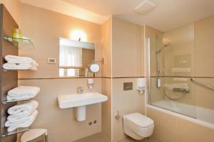 a bathroom with a sink and a toilet and a shower at Dubrovnik Luxury Residence – L’Orangerie in Dubrovnik