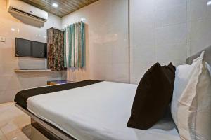 Ένα ή περισσότερα κρεβάτια σε δωμάτιο στο Hotel O Taj Lodging and Boarding