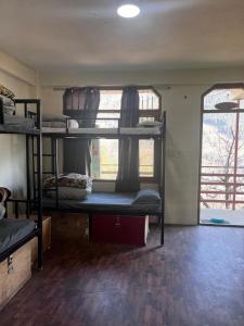 Postelja oz. postelje v sobi nastanitve Nomadic Den Manali