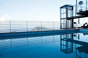 a swimming pool with blue water in a building at Chincamea in Casarza Ligure