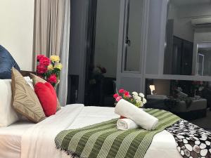 Un ou plusieurs lits dans un hébergement de l'établissement Star Residence KLCC By FZB