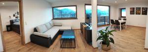 a living room with a couch and a table at Apartment Dengg in Kössen