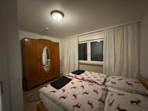 a bedroom with a bed and a window at Viva la Wildbad in Bad Wildbad