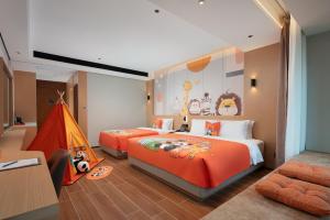 Vuode tai vuoteita majoituspaikassa 滨江万璟酒店 One Gem Hotel