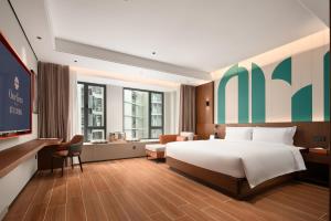 Vuode tai vuoteita majoituspaikassa 滨江万璟酒店 One Gem Hotel