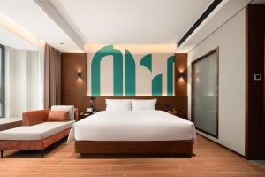Vuode tai vuoteita majoituspaikassa 滨江万璟酒店 One Gem Hotel