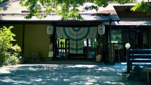 a building with a curtain on the front of it at 中棚荘 in Komoro