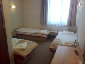 Postel nebo postele na pokoji v ubytování Hotel Nowostawy A2 MOP