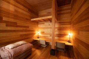 Postel nebo postele na pokoji v ubytování Guesthouse Hatagoya sato 旅籠屋さとう