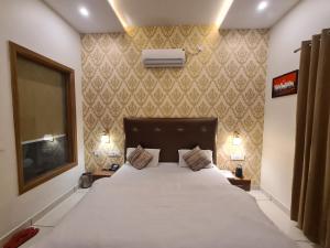 Mahadev Residency客房内的一张或多张床位
