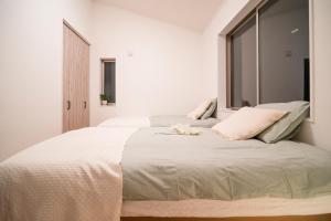 Llit o llits en una habitació de 全新三之轮一户建b栋
