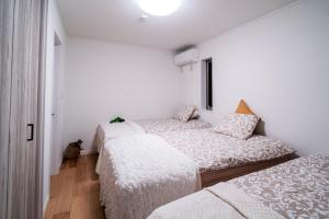 Llit o llits en una habitació de 全新三之轮一户建b栋