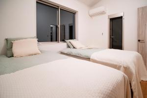 Llit o llits en una habitació de 全新三之轮一户建b栋
