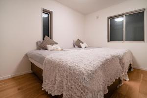 Llit o llits en una habitació de 全新三之轮一户建b栋