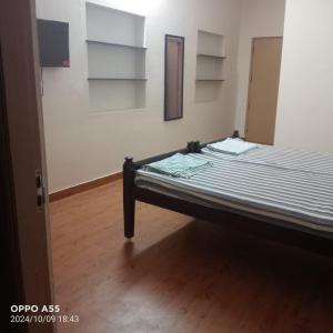 a bedroom with a bed in a room at Serenity Space in Dānishpet +38 photos