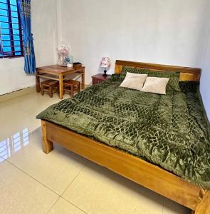 Postel nebo postele na pokoji v ubytování Homestay Núi Đá Tả Phìn