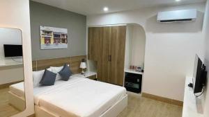 Телевізор і / або розважальний центр в FIRST Studio Hotel Da Nang