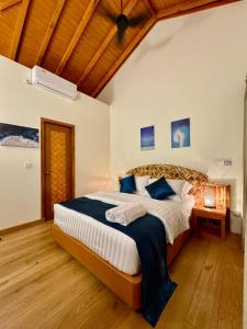 Postel nebo postele na pokoji v ubytování Rattehi Inn at Rakeedhoo