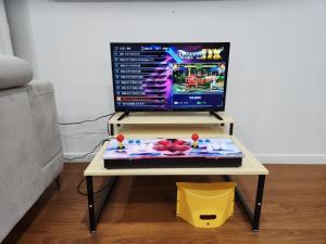 a table with a computer on top of it at Paju Heyri Hills Modern House in Paju
